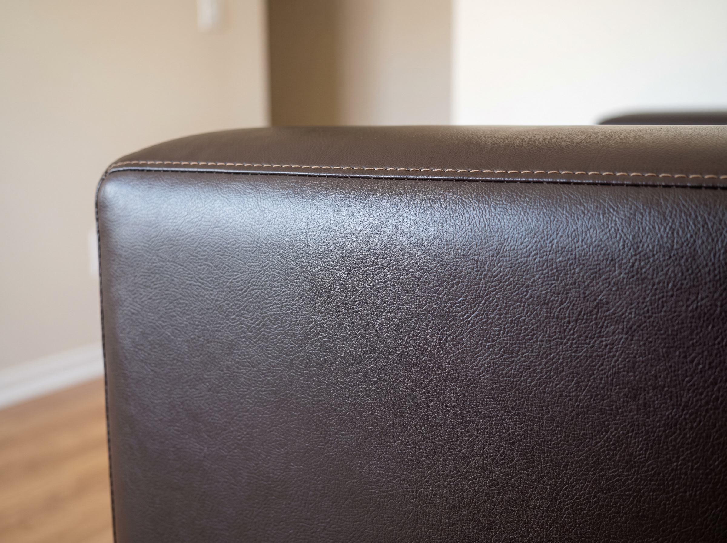 Restored vinyl sofa panel after professional peeling repair service in Dubai